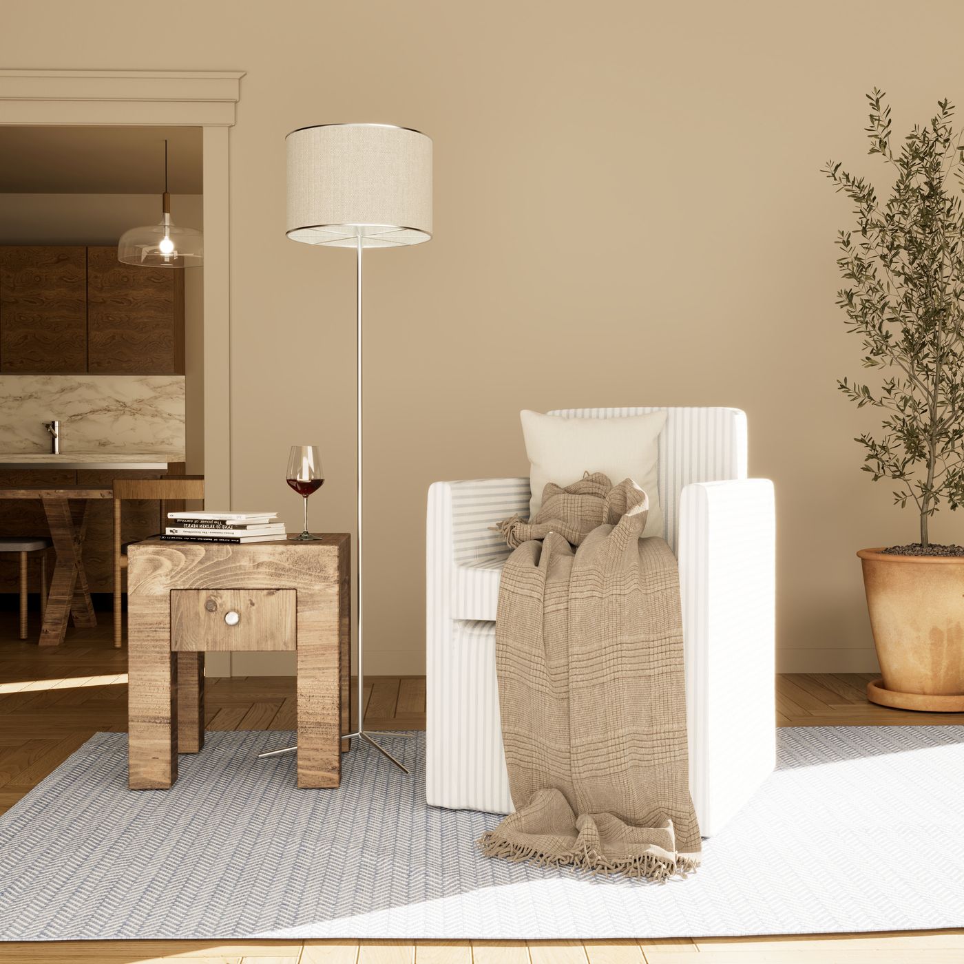Living-room corner with a linen armchair, side table and olive tree